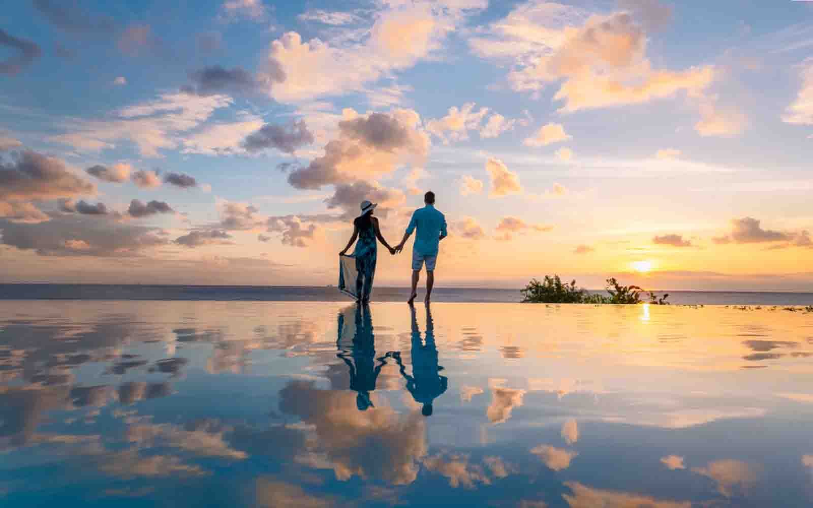 Romantic couple photography at sunset by an infinity pool in Costa Rica